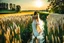 Placeholder: wide angle shot of golden wheat field next to river ,a watermill on river, a beautiful girl in pretty long dress walking in