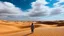 Placeholder: Standing in the desert, I can feel the heat radiating from the red sand beneath my feet. The vast sky above me is filled with fluffy white clouds. #desert #sky #sand