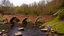 Placeholder: stone and brick bridge across a rocky ravine