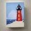 Placeholder: tiny oil painting of tiny lighthouse, plain white background, solid white background, tiny white canvas, tiny white frame, plain white wall, melancholy, tender, moody, vintage, delicate arrangement, beautiful composition, etsy, aesthetic layout, plain solid white background