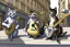 Placeholder: Group of three mature cats musicians, one cat playing guitar, one cat playing drums, one cat holding microphone and singing, street, Vienna, smiling, sunny day, model style, hyper realistic, extremely accurate, delicate, extremely detailed, Graphic novel style, wide-angle, open aperture, superfine pencil