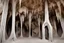 Placeholder: large cave winding pipe with stalactites and stalagmites