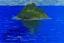 Placeholder: A big blue island on the ocean painted by Claude Monet