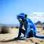 Placeholder: a blue monkey in the desert