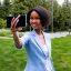 Placeholder: A short haired, black female software engineer taking a selfie in front of Building 92 at Microsoft in Redmond, Washington