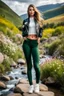 Placeholder: fullbody shot of young-beautiful-girl-with-a-perfect-face-with-make-up-wearing- sport pants and jacket standing ,geen hills ,nice nature environment ,wild flowers,clean water river with colorfull rocks in floor