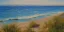 Placeholder: Impressionist painting of a summer day at the beach looking out at the ocean