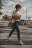 Placeholder: color photo of a student girl 22 years old ,short hair with her books in her hand walking in street,next to trees.