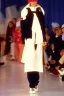 Placeholder: late 1990's women fashion.interesting hoodie with long tippet integrated to bolero -like attachement with pockets which goes up to a Hat with a visor with integrated headphones to it. Karjalainen kuvio, Karjala patterns. Haute couture. This term is French for high sewing or high dressmaking and often refers to exclusive designer creations. ... Label. ... Ensemble. ... Silhouette. ... Off-the-rack. ... Hemline. ... In vogue. ... Fashion-forward.