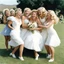 Placeholder: [high res photo by Russ Meyer] at her wedding, the blonde bride is surrounded by her bridesmaids, who tickle her endlessly. the bride writhes on the grass, laughing as the bridesmaids tickle her everywhere.