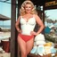 Placeholder: [high res colour photo by Russ Meyer: pull-up thick diapers, seen from bellow] blonde Sally has an idea for a business. She knows that there were incontinent women like herself with large busts out on the beach and she is missing adult ultra thick pull-up diapers with the matching bras. Her concept is to pair diaper designs with bra designs, specifically themed for outdoor wear.