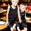 Placeholder: Russian tomboy boyish boylike short man's haircut boyish features in black girlish nightgown in restaurant