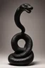 Placeholder: an ominous small statuette made of ebony in the form of a snake coiling around a rock