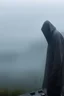 Placeholder: A hooded figure In the fog