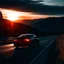 Placeholder: dark night, car taillights, driving towards a rising sun in the distance, mountains and forests next to the road, photo quality