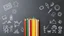 Placeholder: Blackboard design with a bunch of colored pencils in the middle of the image and children's drawings on a light blue background