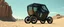 Placeholder: guy standing inside laid back futuristic sci-fi glass human form bomb like car coffin on wheels, two wheels ar on the middle tipping point, one in the back and one in the front