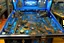 Placeholder: An indigo cybernetic pinball themed metropolis painted by Edward Hicks