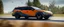 Placeholder: A national geographic award winning photograph of a military fighter jet station wagon wasp hybrid designed by volkswagen only one vehicle per image painted metallic orange traveling at a high rate of speed, jet intake off of front center of vehicle and jet exhaust out the rear with bright blue flame