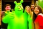 Placeholder: people getting a selfie with the "gingerbread man" from shrek