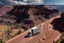Placeholder: A Tesla 'Semi' (semi truck) is parked, in the 'Grand Canyon National Park'. (CINEMATIC, WIDE ANGLE LENS, PHOTO REAL)