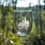 Placeholder: Create hyper-realistic photo of a glass tumbler in a wild forest. Inside, a miniature [Istanbul] with landmarks. A sleek white 3D text of [City] blends naturally into the landscape in background. Soft bright daylight, reflections, and subtle imperfections like fingerprints. DSLR quality, sharp focus.