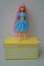 Placeholder: empty yellow and blue barbie doll box