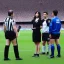 Placeholder: Nahomi Kawasumi in a referee jersey officiating for a soccer match at Wembley Stadium