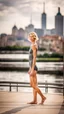 Placeholder: beautiful anorexic young woman, total shot, shiny anthracite triathlon swimsuit, short blond wavy bob hair, blurred city background