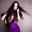 Placeholder: alluring witch of darkness in purple dress with very long brown hair