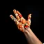 Placeholder: photograph made on a gopro hero 11 camera, down-shot of a mosaic of sushi pieces perfectly forming a hand shape, dark negative space,