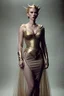 Placeholder: Scarlett Johansson, as an elf queen wearing a gold lame dress with spaghetti straps, standing against a dark background with muted stage lighting