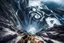 Placeholder: at the base of the rocky mountain peninsula, a great whirlpool waterfalls into deeper unknown depths