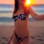 Placeholder: beautiful girl with bikini on the beach with sunset scene