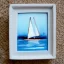 Placeholder: tiny oil painting of tiny sailboat, plain white background, solid white background, tiny white canvas, tiny white frame, melancholy, tender, moody, vintage, delicate arrangement, beautiful composition, etsy, aesthetic layout, plain solid white background