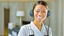 Placeholder: hotel housekeeping smiling with white earbuds