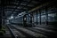 Placeholder: An old vintage train station on a foggy day, add deep dark color and reflections in and around the old stempunk train