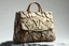 Placeholder: "Create a hyper-realistic image of a AVAVOGUE handbag with an exterior crafted entirely from jagged stone and rock fragments. The body of the bag is made up of various rough-textured stones and sharp-edged rock pieces, carefully assembled to form the iconic Louis Vuitton shape. Each stone is distinct, with natural cracks, crevices, and color variations, creating a rugged and organic appearance. The iconic Louis Vuitton monogram is subtly integrated into the stone surface, carved into the ro