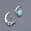 Placeholder: round earring, jewlery, silver, crescent moon, aquamarine, a bird, spread wings