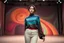 Placeholder: beautiful lady in sureal stage made of random size sphers with helical strip colors in clothing similar to environment fullbody posing to camera