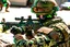 Placeholder: A military man shoots from behind