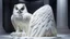 Placeholder: hyper realistic render of a giant owl carved out of white marble, sculpture is displayed inside of a big art exhibit