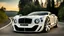 Placeholder: A sleek white shiny (((hypercar bentley))), its contours and details perfectly captured in a (((cinematic view))), zipping along a winding road under a beautiful blue black night sky