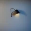 Placeholder: shadowlamp casts pattern shadows on the wall