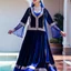 Placeholder: create a video of beautiful azerbaijani lady wearing traditional clothing dancing with sari gelin famous song and music of azerbaijan in a pretty villa garden