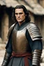 Placeholder: Joaquin Phoenix from year 2000, draped waves haircut, black hair, in medieval setting, in burnished medieval samurai armor