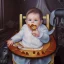 Placeholder: a baby in a fantasy card illustration, cartoon style