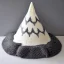 Placeholder: Model of the Matterhorn made of wool knitting, grey and white, mountain