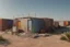 Placeholder: Can you please come up with a design concept for a refugee camp that houses displaces Palestinians that is Meaningful, resilient, self sufficient, safe and takes into consideration Palestinians culture and religious beliefs in the dessert using shipping containers