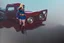 Placeholder: Supergirl driving an old 'Ford T'